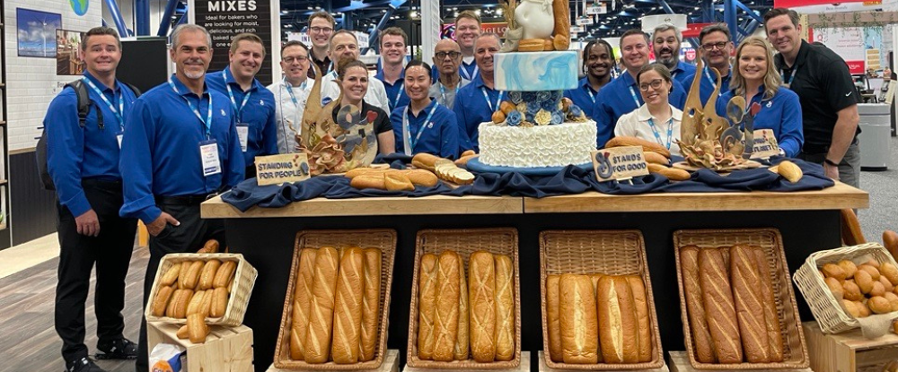 The team at IDDBA showcasing fresh-baked bread.