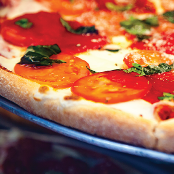 Blurred pizza image with white “Best of Pizzeria” text overlay.