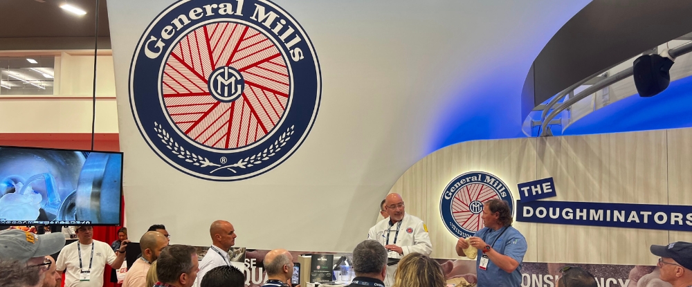 The Doughminators™ doing live demonstration with pizza dough at the General Mills booth at Pizza Expo