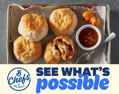 A baking tray holds four golden savory pastries, one revealing a reddish filling, alongside a dipping sauce, habanero peppers, and the "Chefs of the Mills" logo with "SEE WHAT'S possible" text.