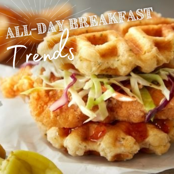 Blurred biscuit sandwich on red and white gingham surface with a side of baked beans and white text “Best Of Restaurant” overlay