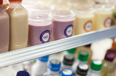 smoothies surrounded by other drinks in a cooler